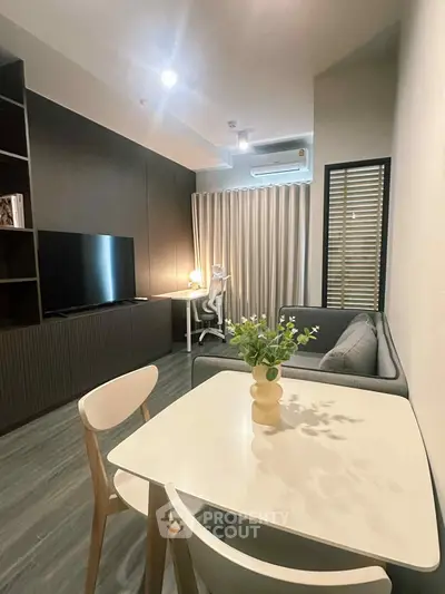 Modern living room with sleek furniture and stylish decor, perfect for urban living.