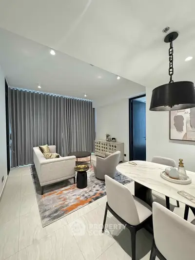 Modern living room with elegant dining area and stylish decor