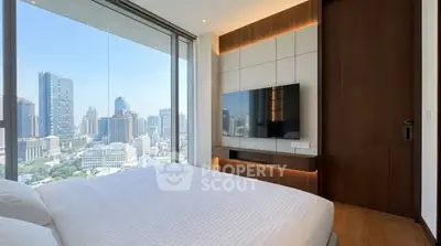 Luxurious bedroom with stunning city view and modern decor