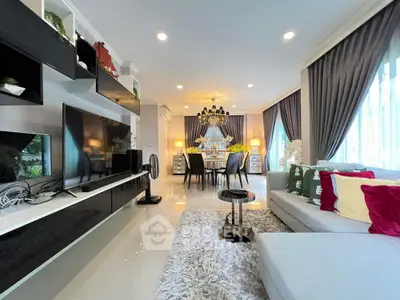 Luxurious living room with modern decor and elegant dining area