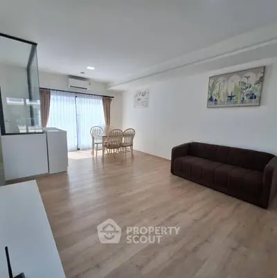 Spacious living room with modern decor and natural light