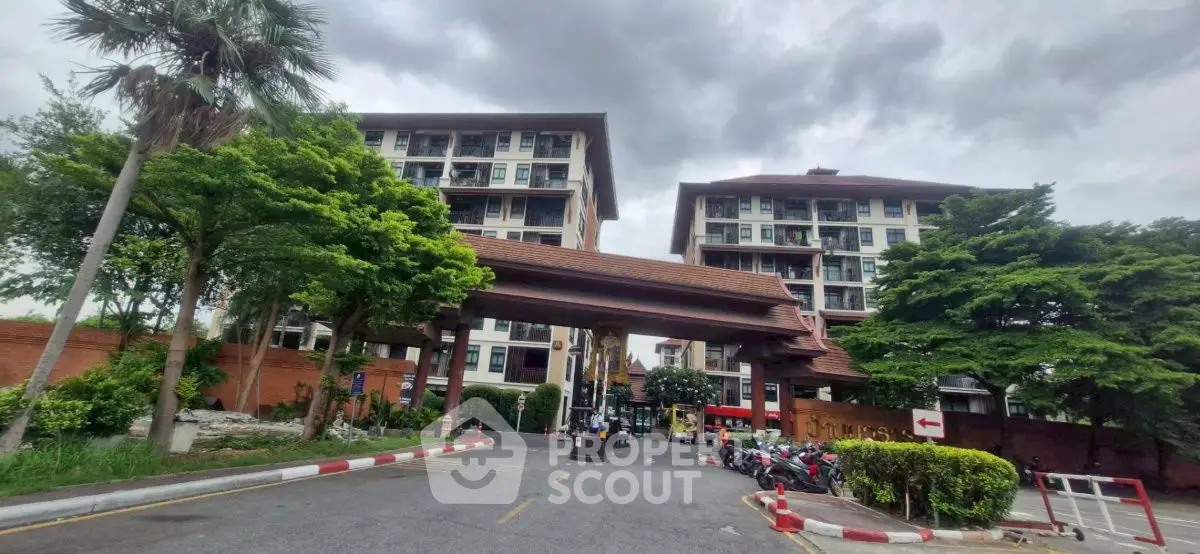Modern residential building with lush greenery and secure entrance