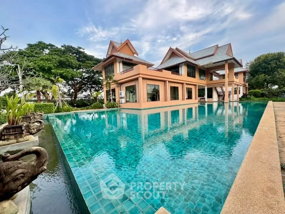 Luxurious villa with stunning pool and lush garden, perfect for serene living.