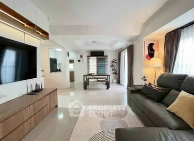 Spacious modern living room with sleek furniture and natural light