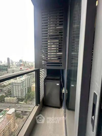 Modern high-rise balcony with city view and sleek design.