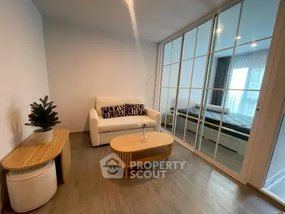 Modern living room with glass partition and cozy decor