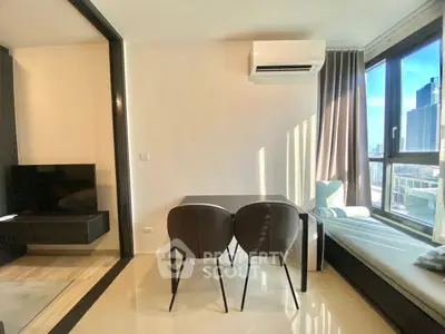 Modern living room with city view, sleek furniture, and natural light.