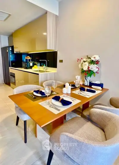 Modern kitchen with elegant dining setup and stylish decor