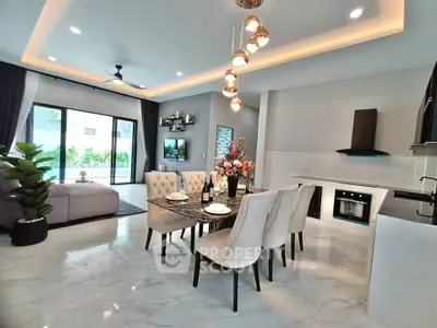 Luxurious open-plan living and dining area with modern kitchen and elegant decor