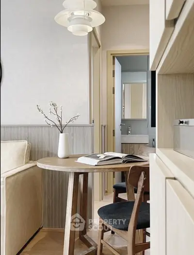 Chic modern living area with stylish wooden furniture and elegant lighting, perfect for cozy gatherings.
