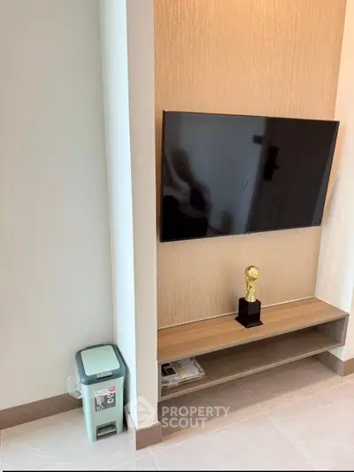 Modern living room with wall-mounted TV and stylish decor