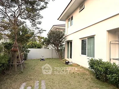 Charming suburban home with spacious garden and lush greenery, perfect for family living.