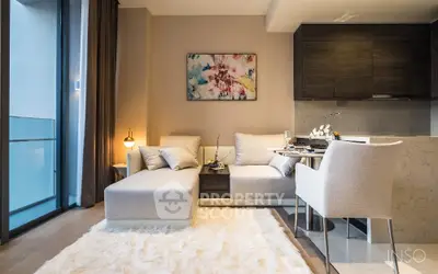 Chic modern living room with plush white sofas, elegant dining area, and a serene balcony view, perfect for upscale urban living.
