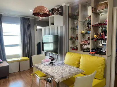 Charming living room with modern decor and ample natural light