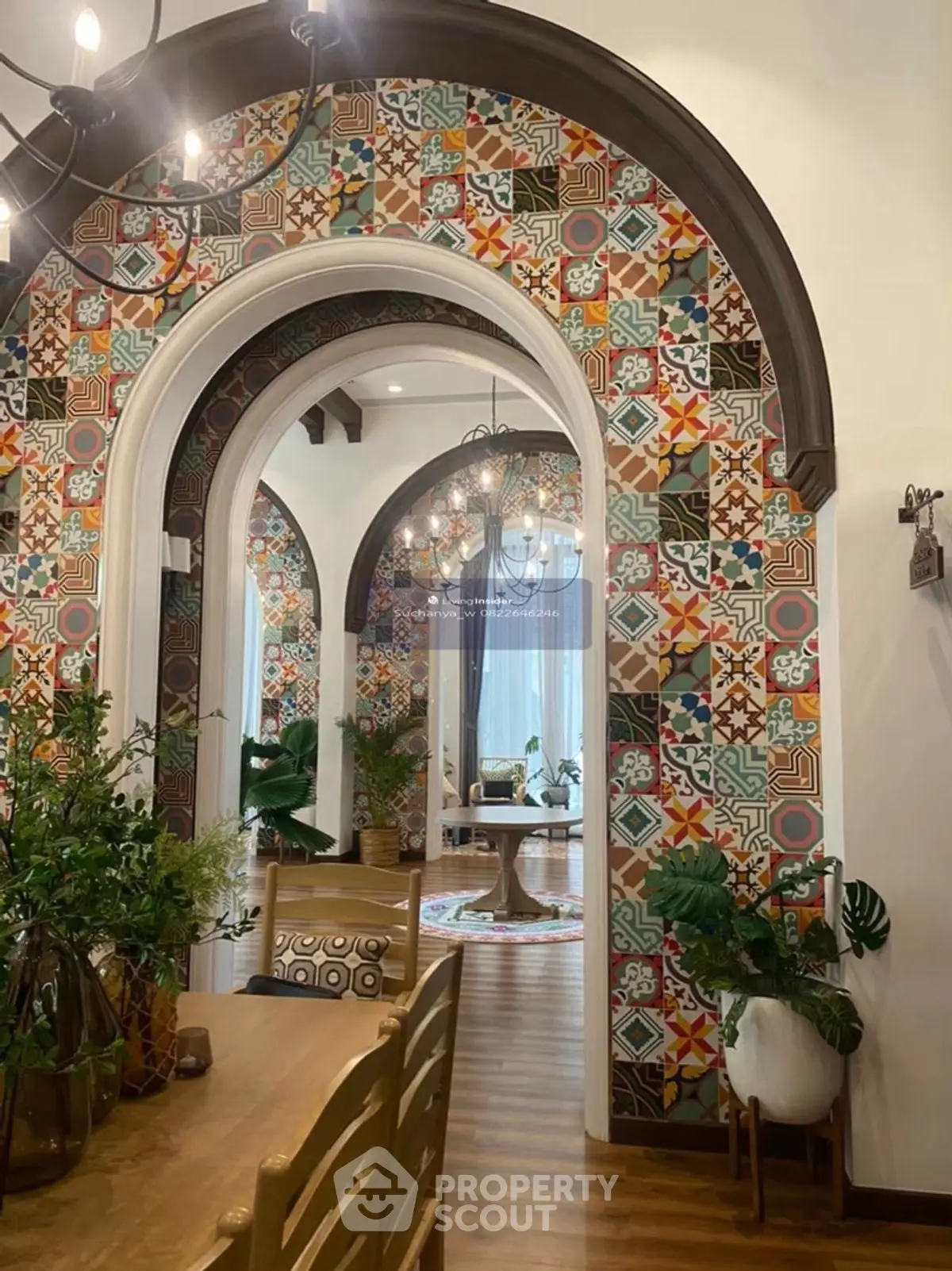 Stunning interior with colorful mosaic arches and elegant decor, perfect for a vibrant living space.