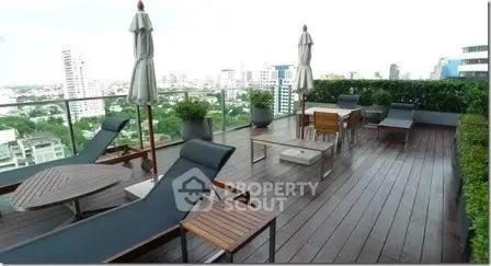 Luxurious rooftop terrace with stunning city views and modern outdoor furniture.