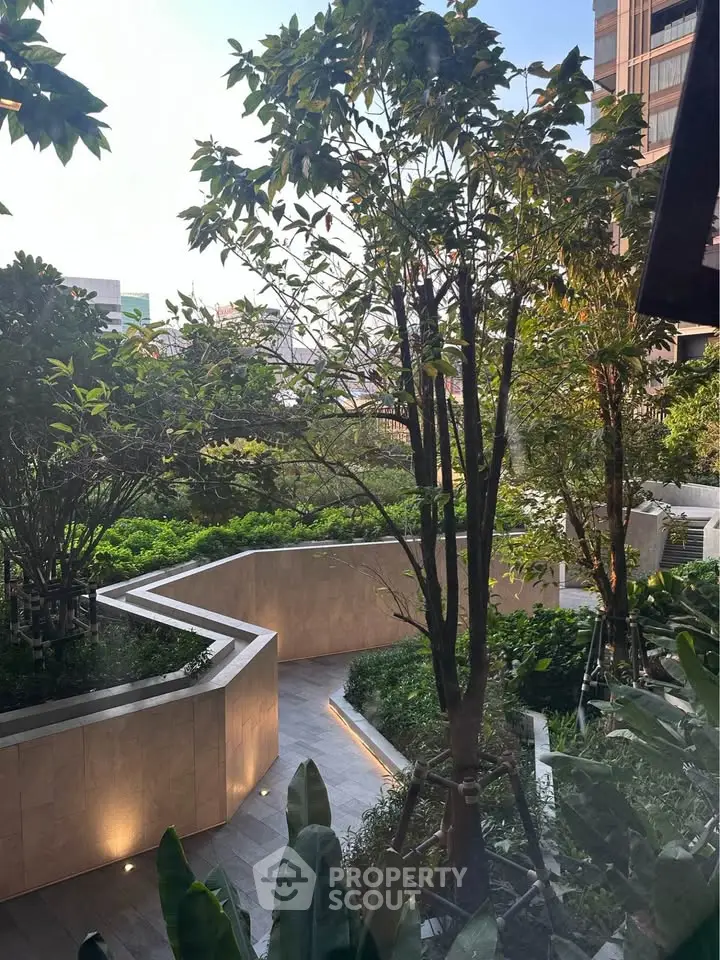 Luxurious garden view with lush greenery and modern landscaping in a high-end residential complex.