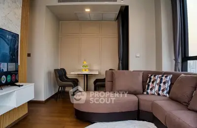 Modern living room with stylish furniture and city view, perfect for urban living.