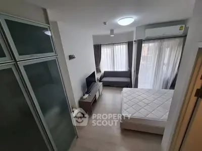 Modern studio apartment with sleek design and ample natural light