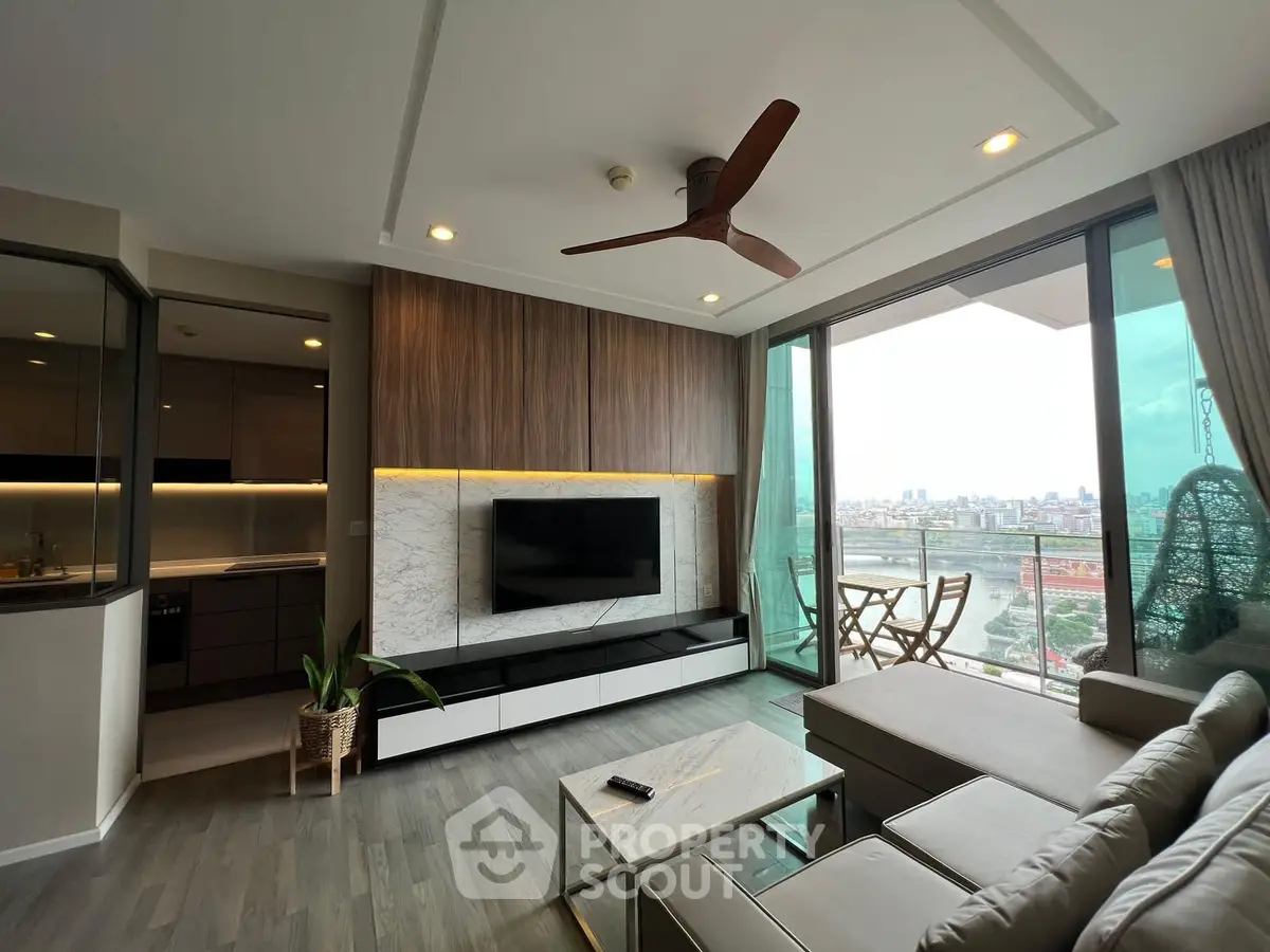 Luxurious living room with stunning city view, modern decor, and spacious balcony in high-rise apartment.