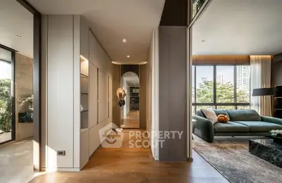Luxurious modern living room with elegant decor and large windows offering a stunning view.