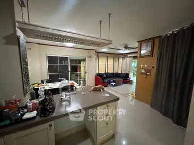 Spacious living room with modern furnishings and open layout, perfect for family gatherings.
