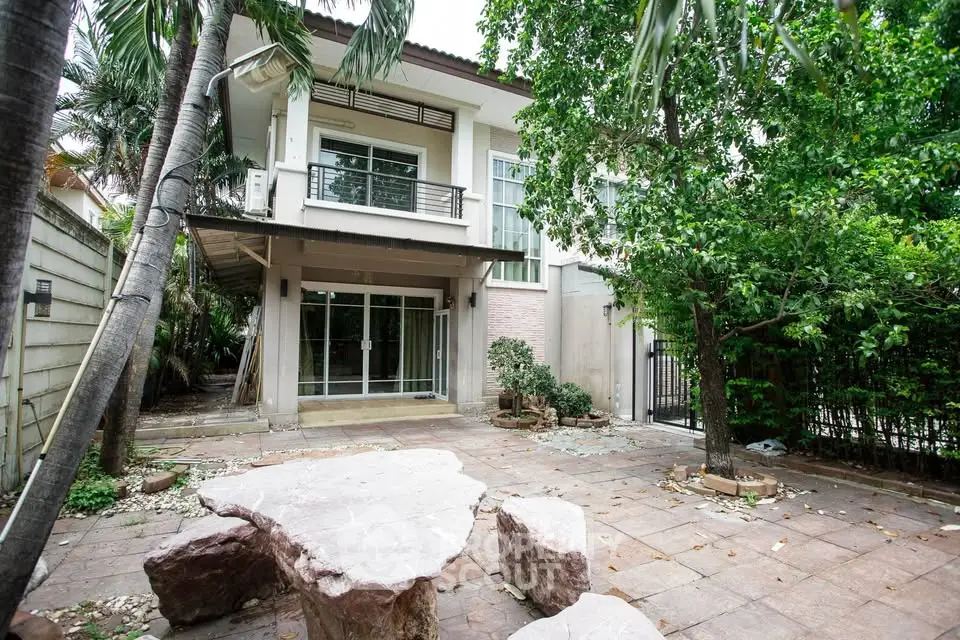 Charming two-story house with lush garden and spacious patio