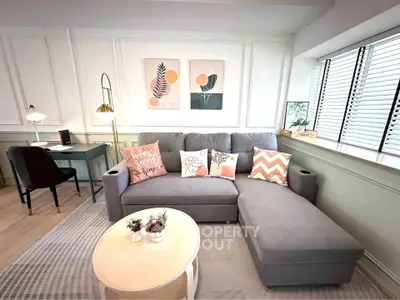 Stylish living room with modern gray sectional sofa and chic decor