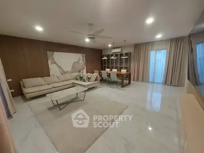Spacious modern living room with elegant decor and ample natural light