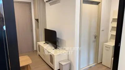 Modern apartment interior with sleek TV stand and compact design, perfect for urban living.