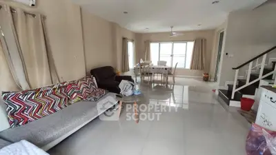 Spacious living room with modern decor and natural light