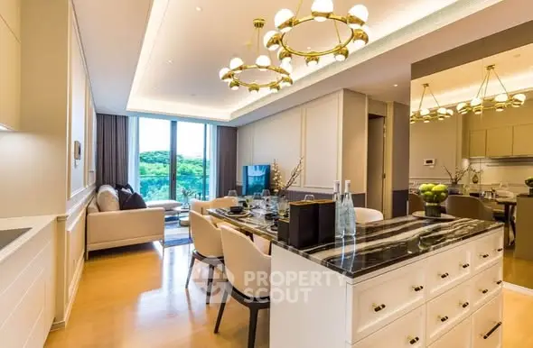 Luxurious open-plan living and dining area with elegant lighting and scenic view.