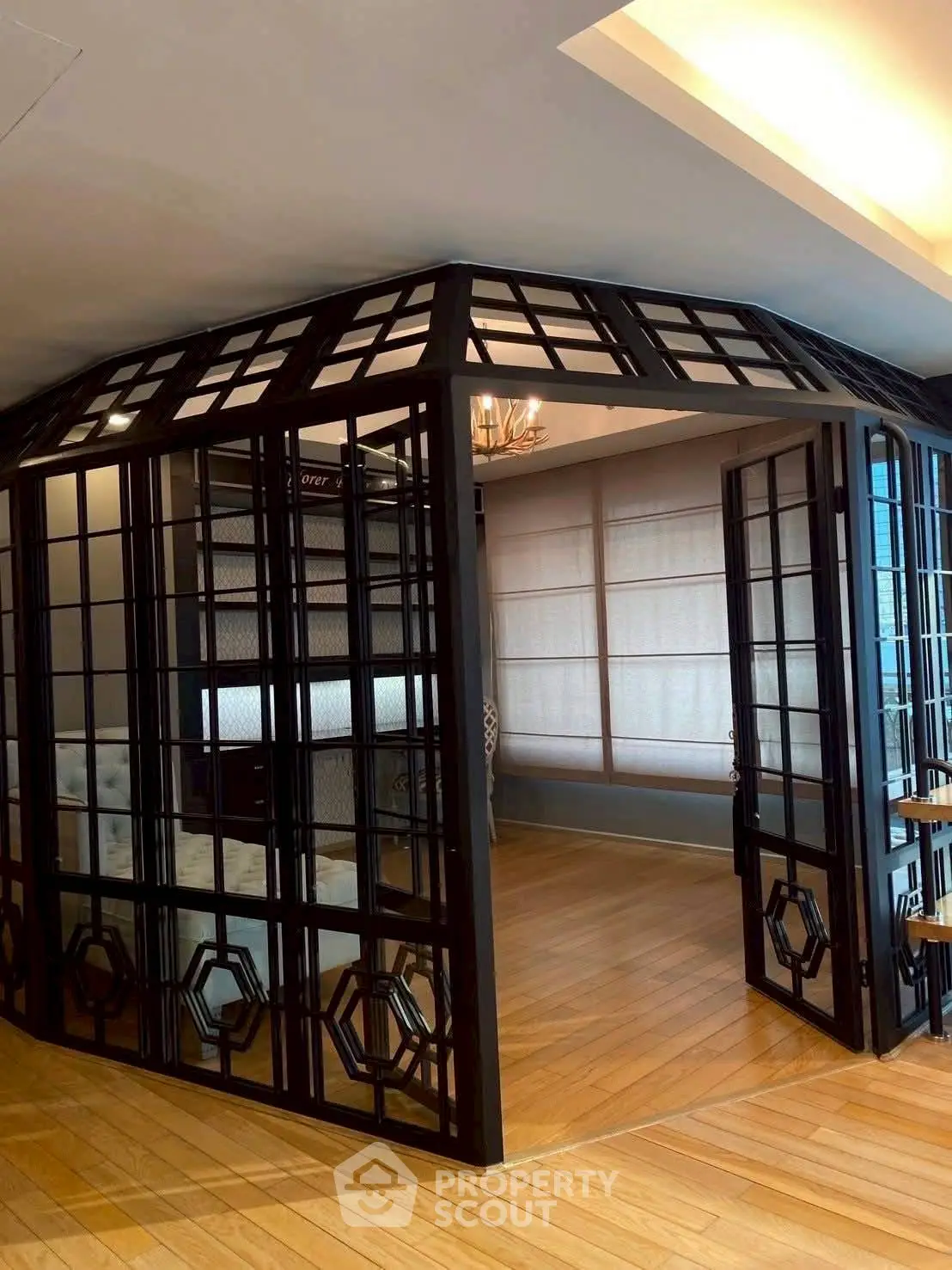 Elegant interior with stylish glass partitions and wooden flooring