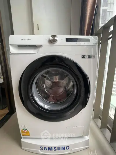 Modern Samsung washing machine in sleek apartment setting