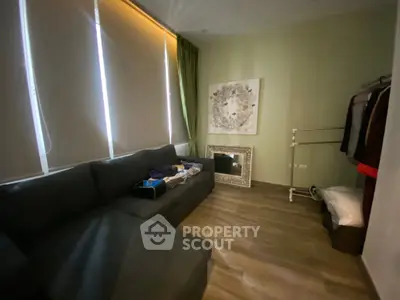 Cozy living room with modern decor and ample natural light