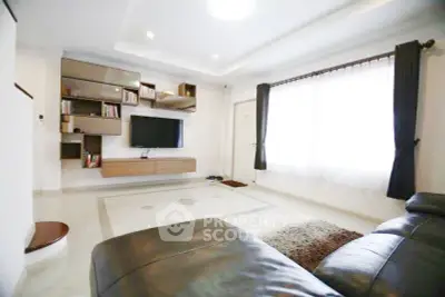 Spacious modern living room with sleek furniture and natural light