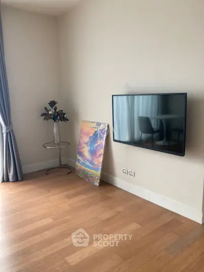 Modern living room with wall-mounted TV and elegant decor