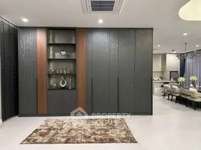 Modern living room with stylish decor and open kitchen layout