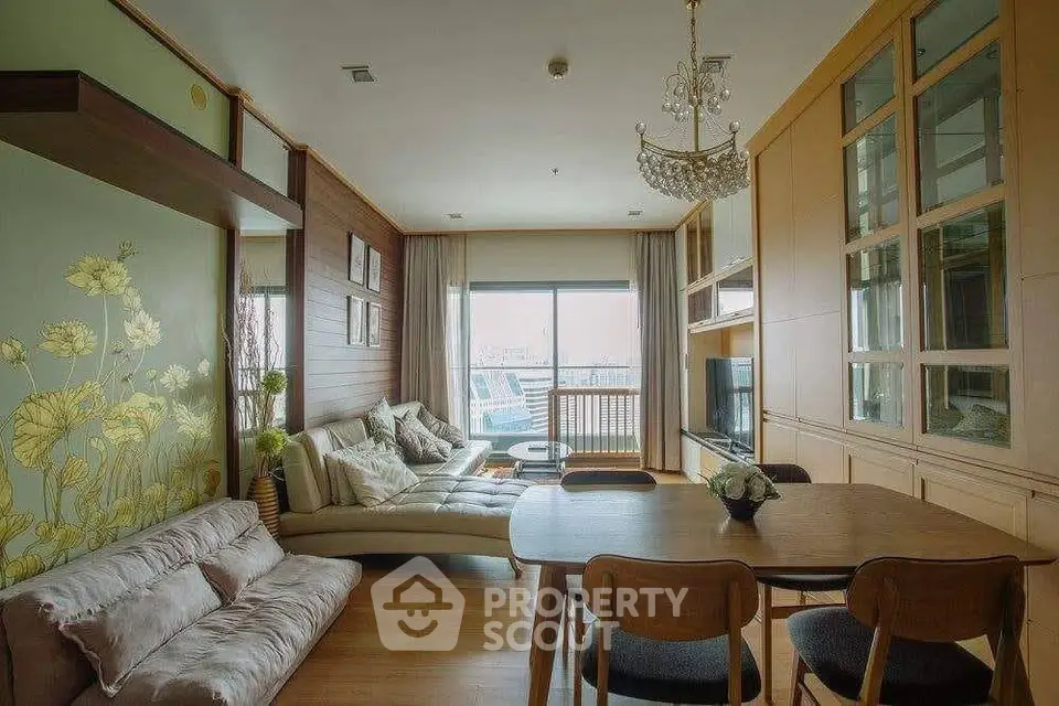 Spacious living room with elegant decor and large window offering a stunning view.