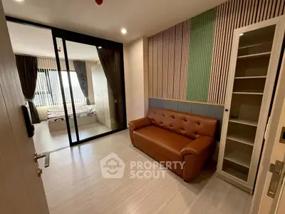 Modern apartment interior with stylish living room and cozy bedroom view.