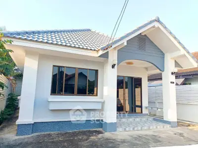 Charming single-story house with tiled roof and modern facade, perfect for cozy living.
