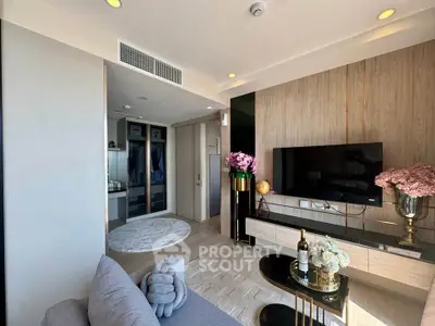 Modern living room with stylish decor and wall-mounted TV