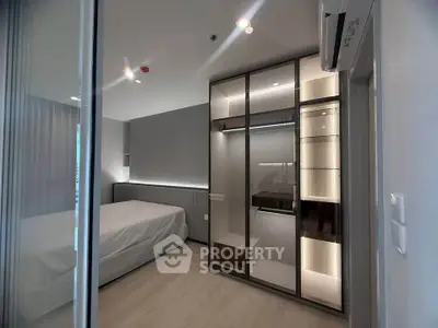 Modern bedroom with sleek built-in wardrobe and ambient lighting