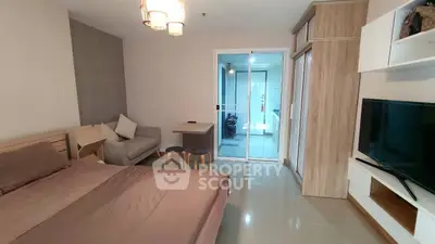 Modern studio apartment with cozy bed and stylish decor