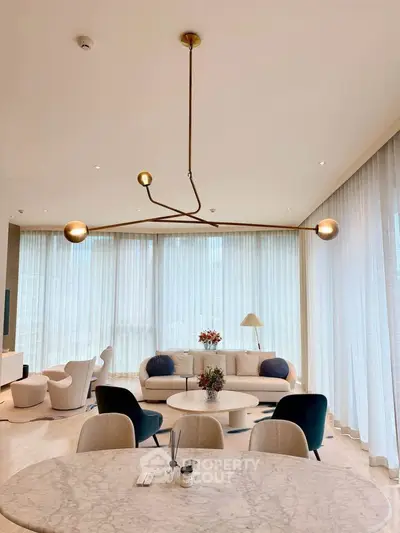 Luxurious modern living room with elegant lighting and stylish furniture, perfect for sophisticated urban living.