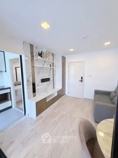 Modern living room with marble accent wall and cozy seating area