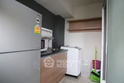 Modern kitchen with sleek appliances and ample storage space