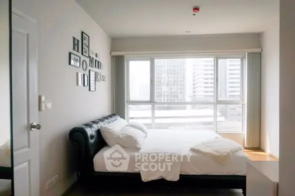 Bright and modern bedroom with city view and stylish decor
