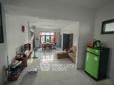 Spacious living room with natural light and modern furnishings