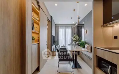 Modern open-plan living and dining area with stylish decor and natural light.